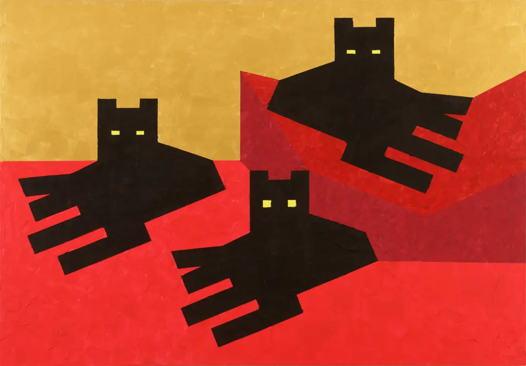Tre gatti neri guardano